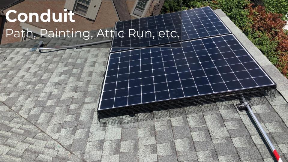 solar panels on roof with visible conduit run